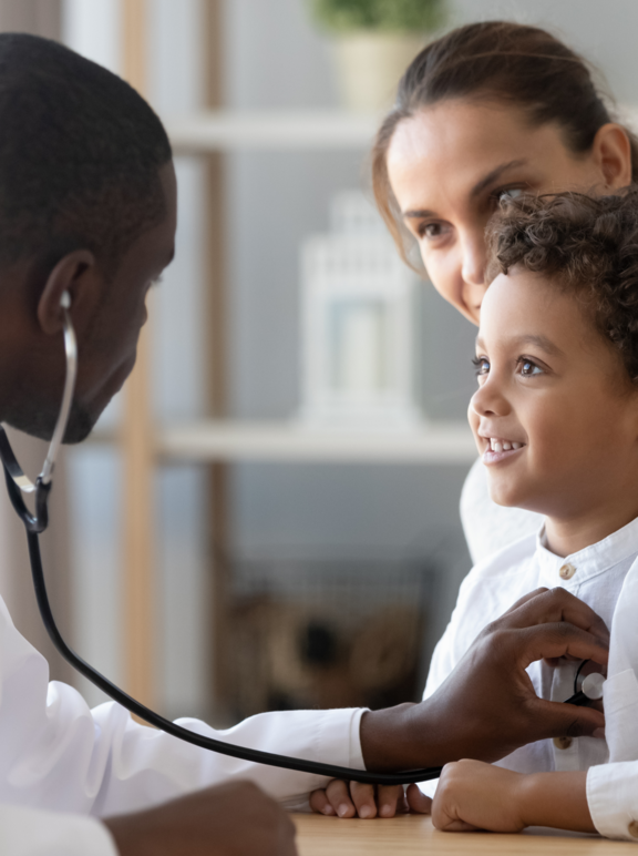Doctor with patient (a mother and her child)
